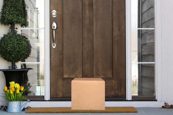 A package in front of a wooden door